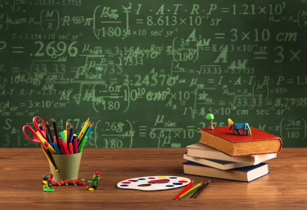 a-stuffed-school-desk-with-green-blackboard-in-the-2026-01-09-14-56-55-utc-697b8c2026f36