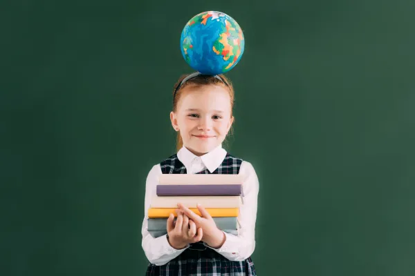 little-redhead-schoolgirl-with-globe-on-head-holdi-2026-01-06-00-12-59-utc-697b8c4ad4cfc
