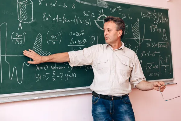 teacher-write-on-the-blackboard-and-explain-a-less-2026-01-05-06-33-30-utc-697b8399750d4